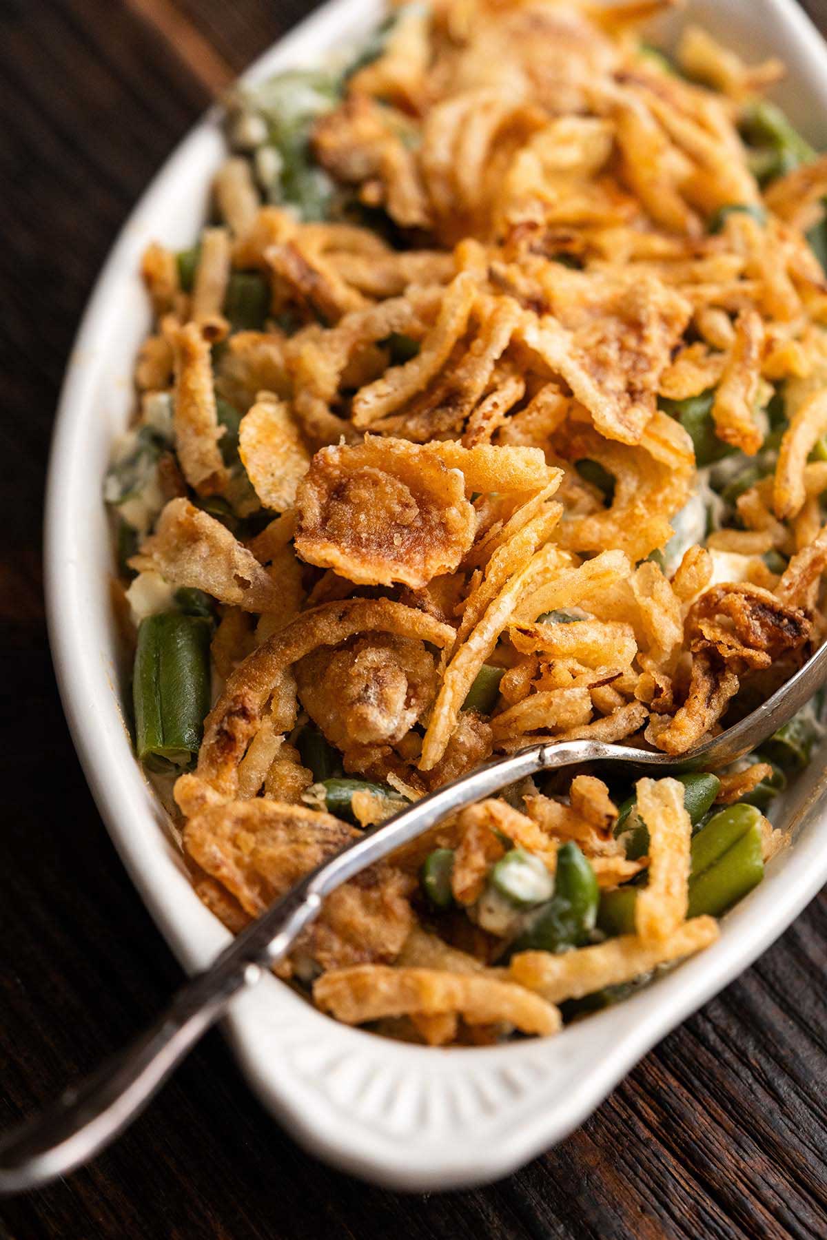 close up of air fryer green bean casserole with fried onion topping