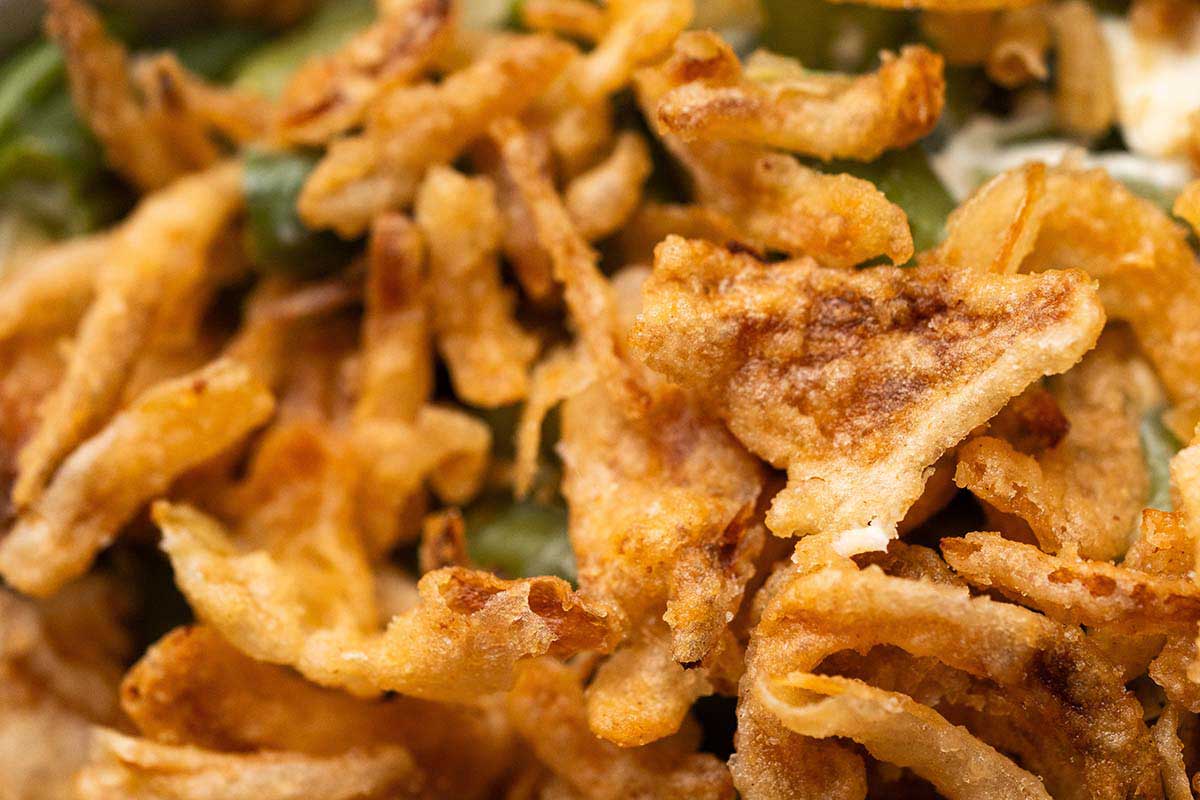close up of crispy fried onion topping on air fryer green bean casserole