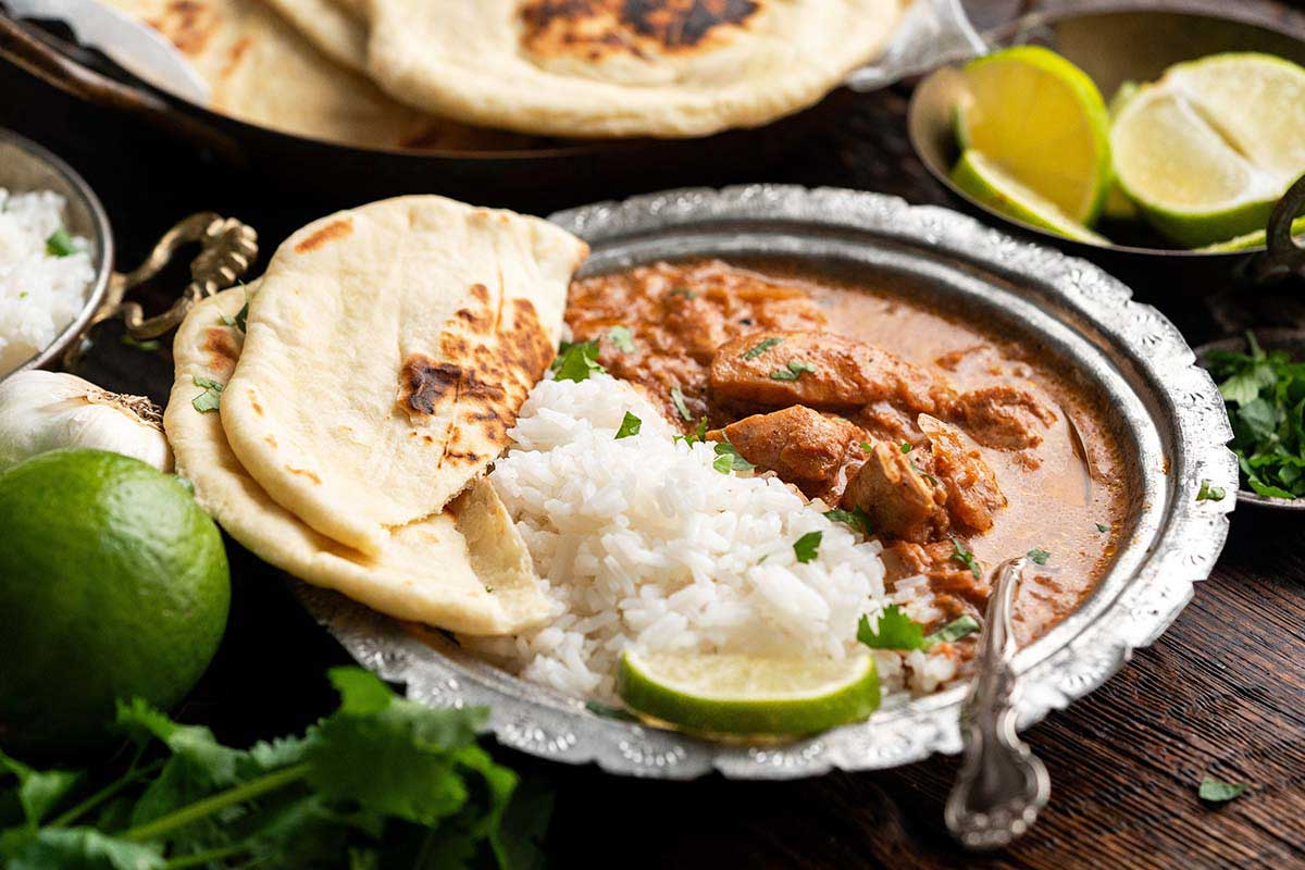 slow cooker murgh makhani served with basmati rice and naan