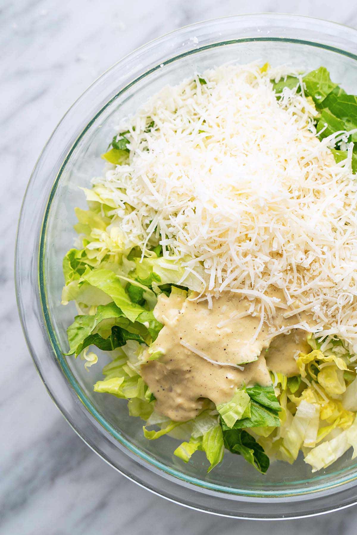 caesar salad topped with parmesan and homemade dressing