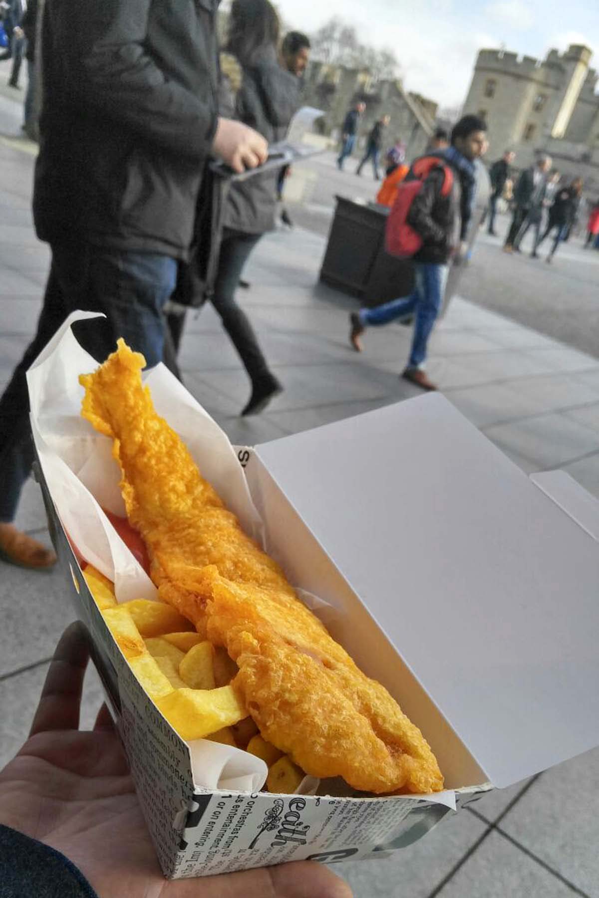 fish and chips in London with Tower of London in background
