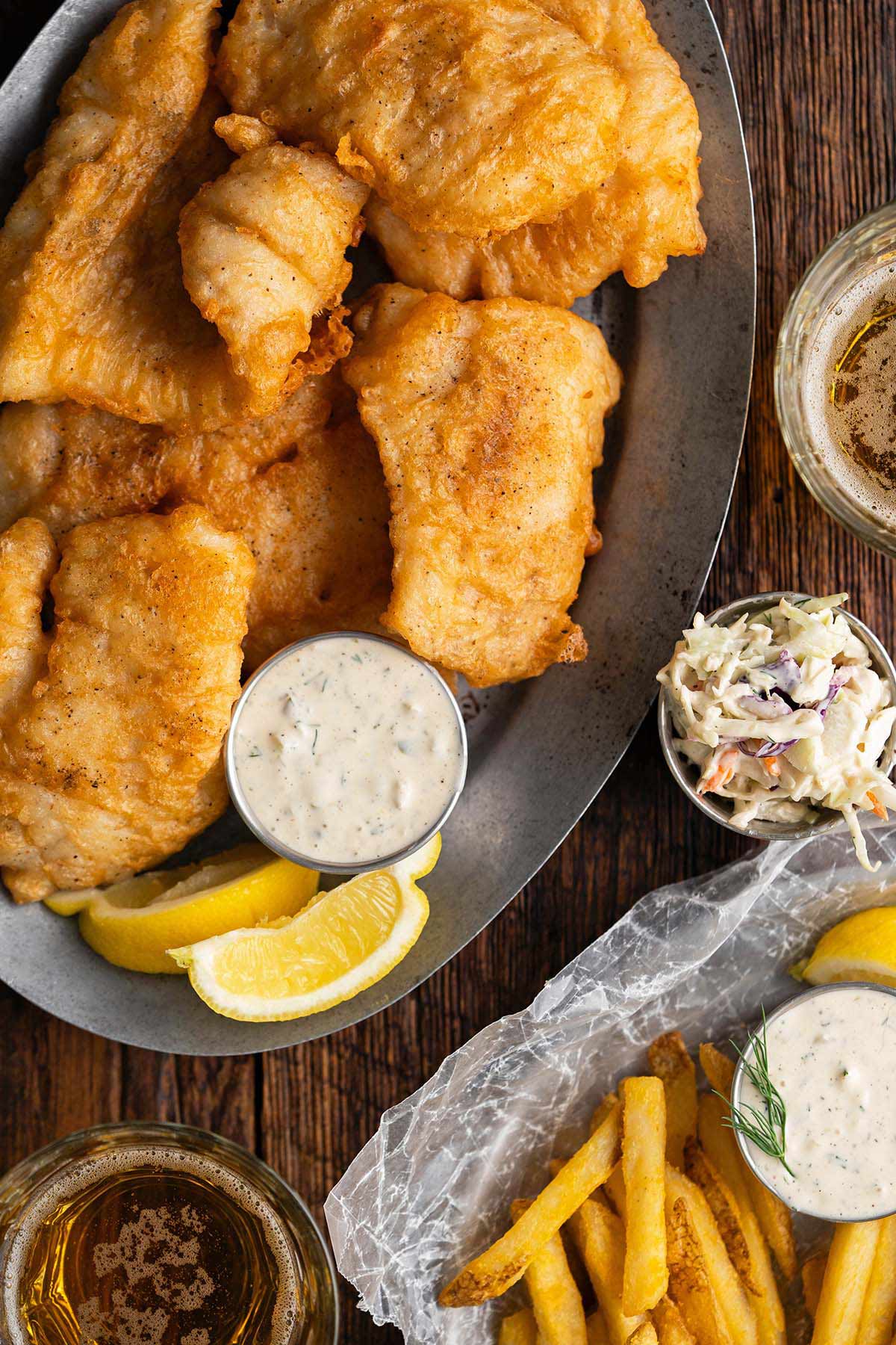 platter of crispy golden fish served with chips and tartar sauce