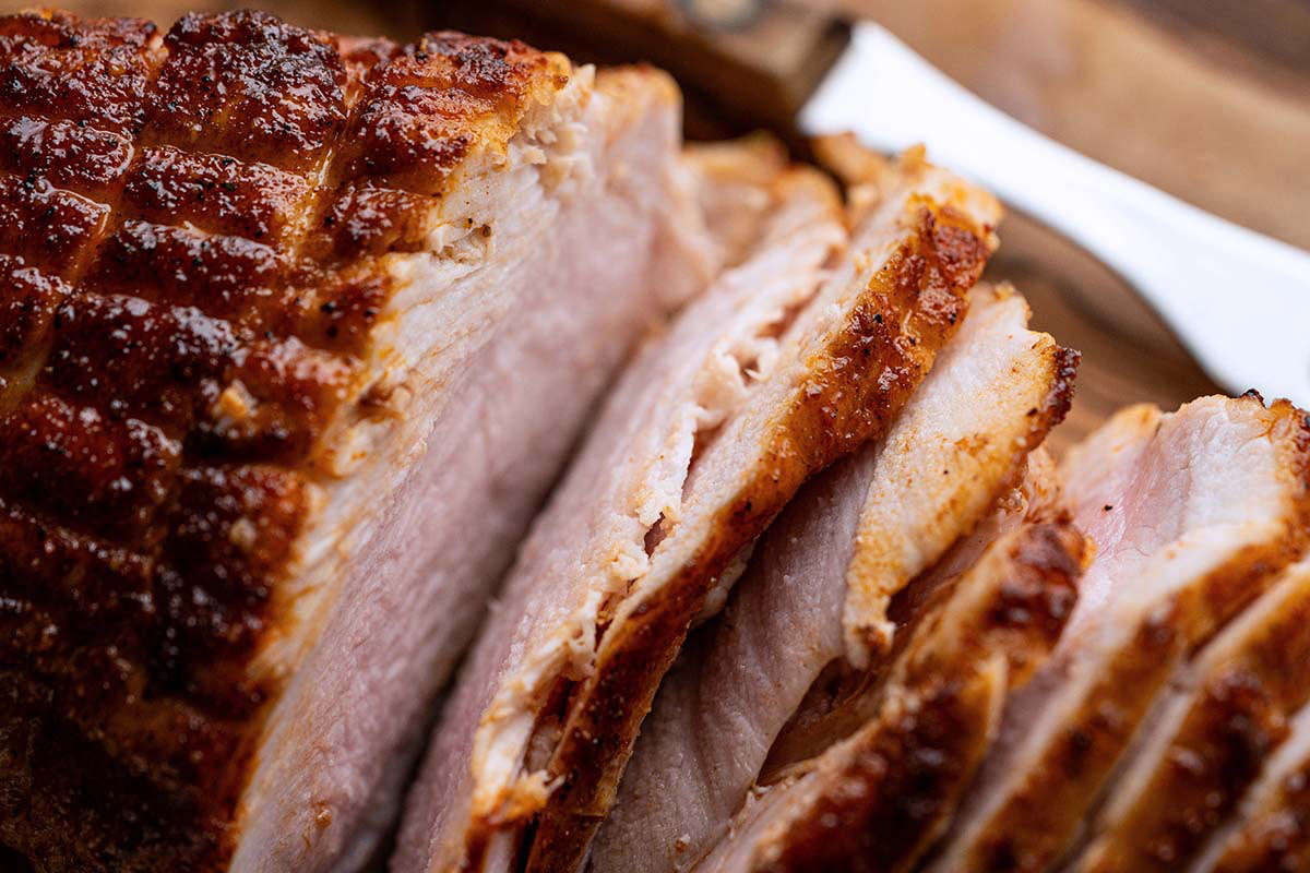 close up of sliced boneless turkey breast roast with golden spiced maple exterior