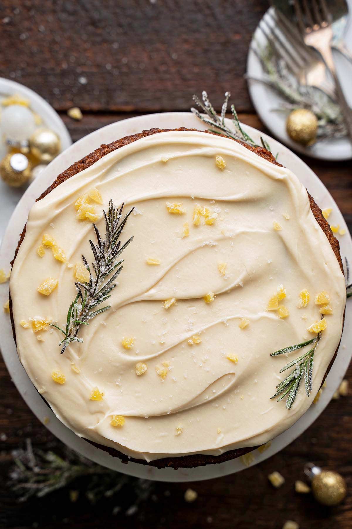 top view of Christmas spice cake with sugared rosemary