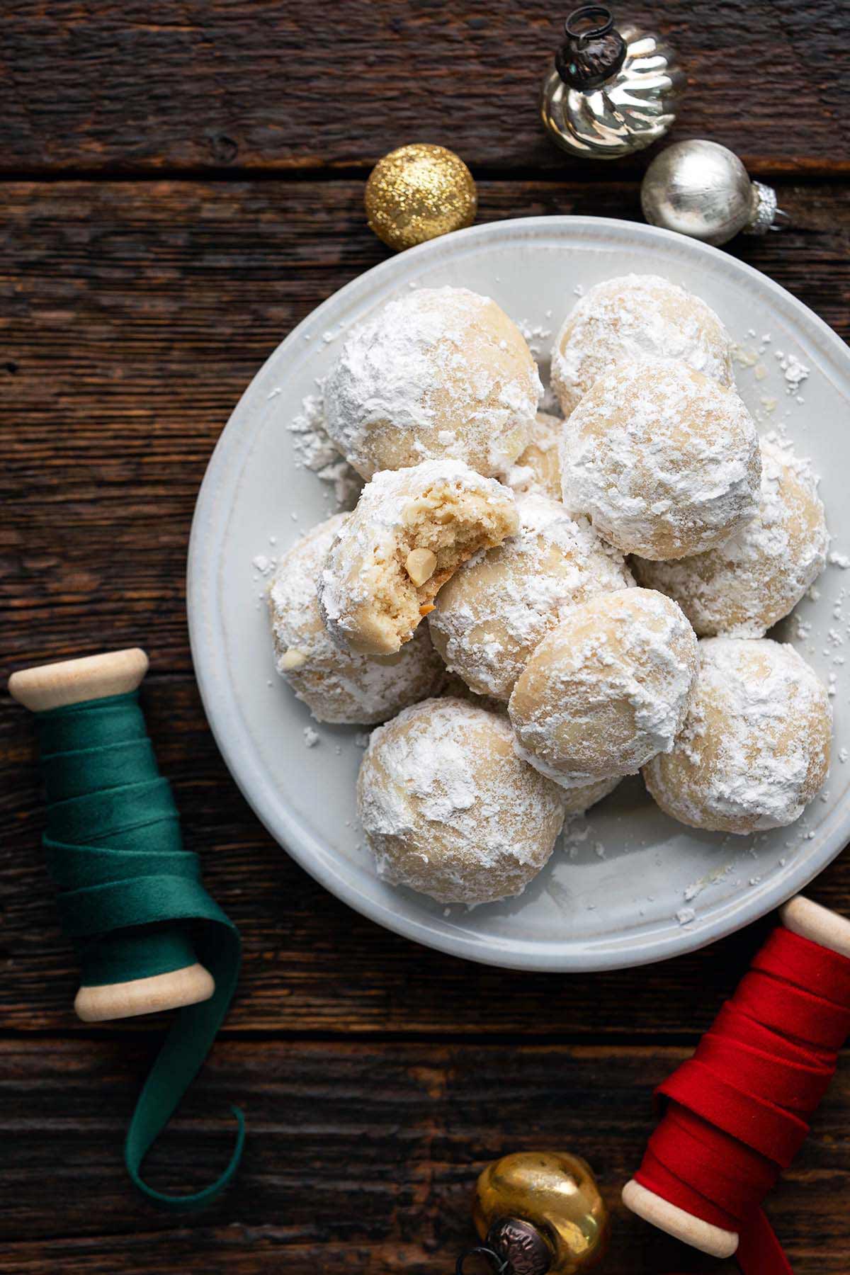 archway cashew nougat cookies copycat recipe on plate with Christmas ornaments and ribbon