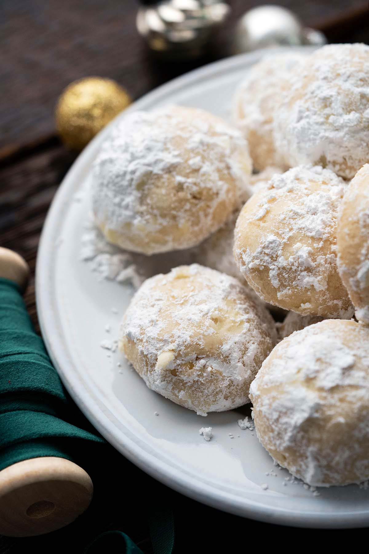 nougat cookies with powdered sugar on white plate