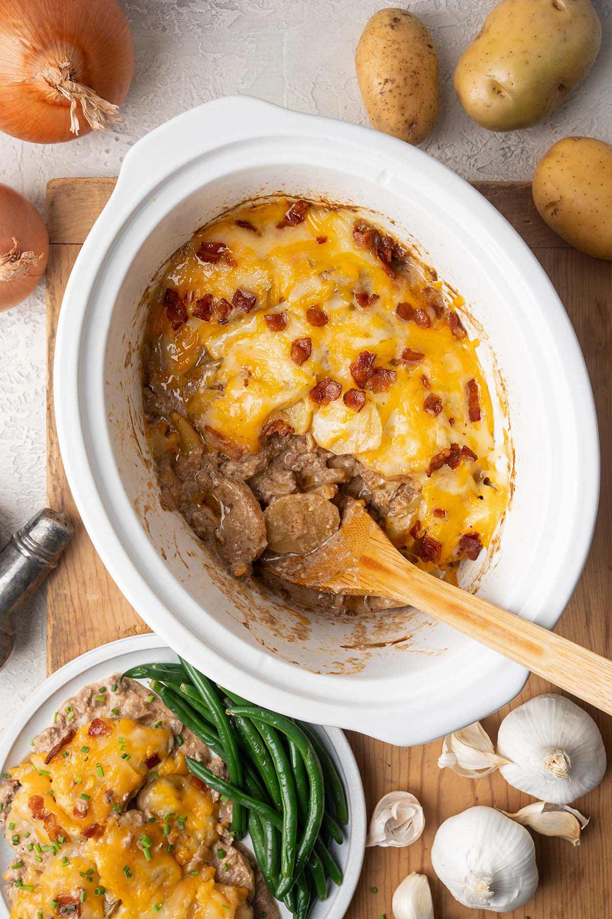top view of cheesy hamburger potato casserole in crockpot