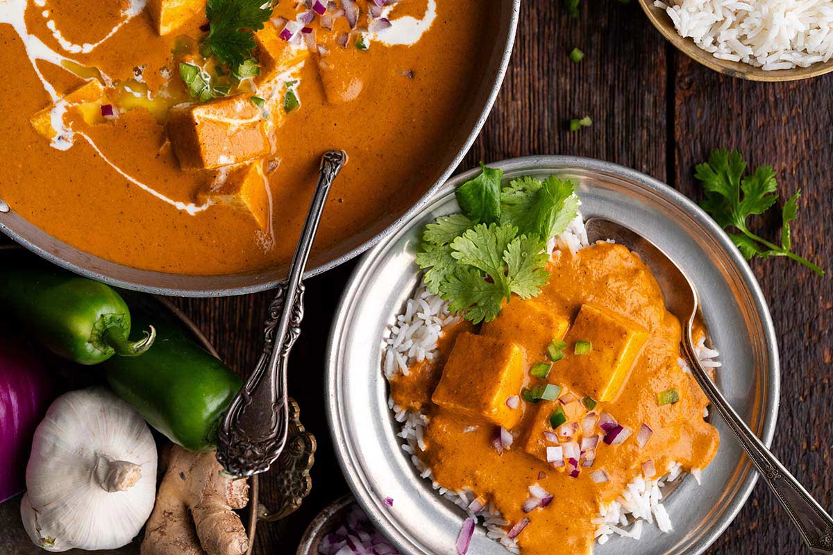 serving of paneer makhani on bed of basmati rice
