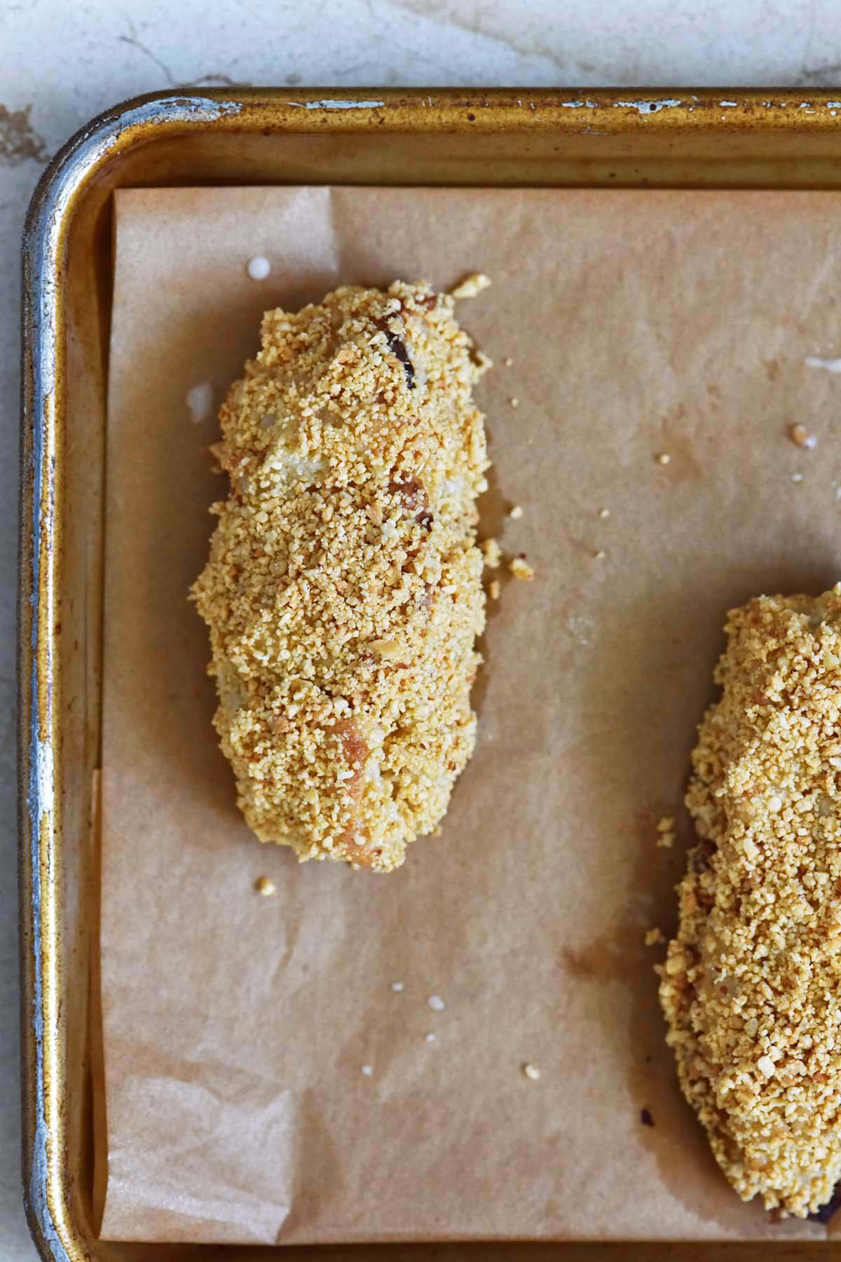 top view of sourdough peanut stick doughnuts on parchment paper