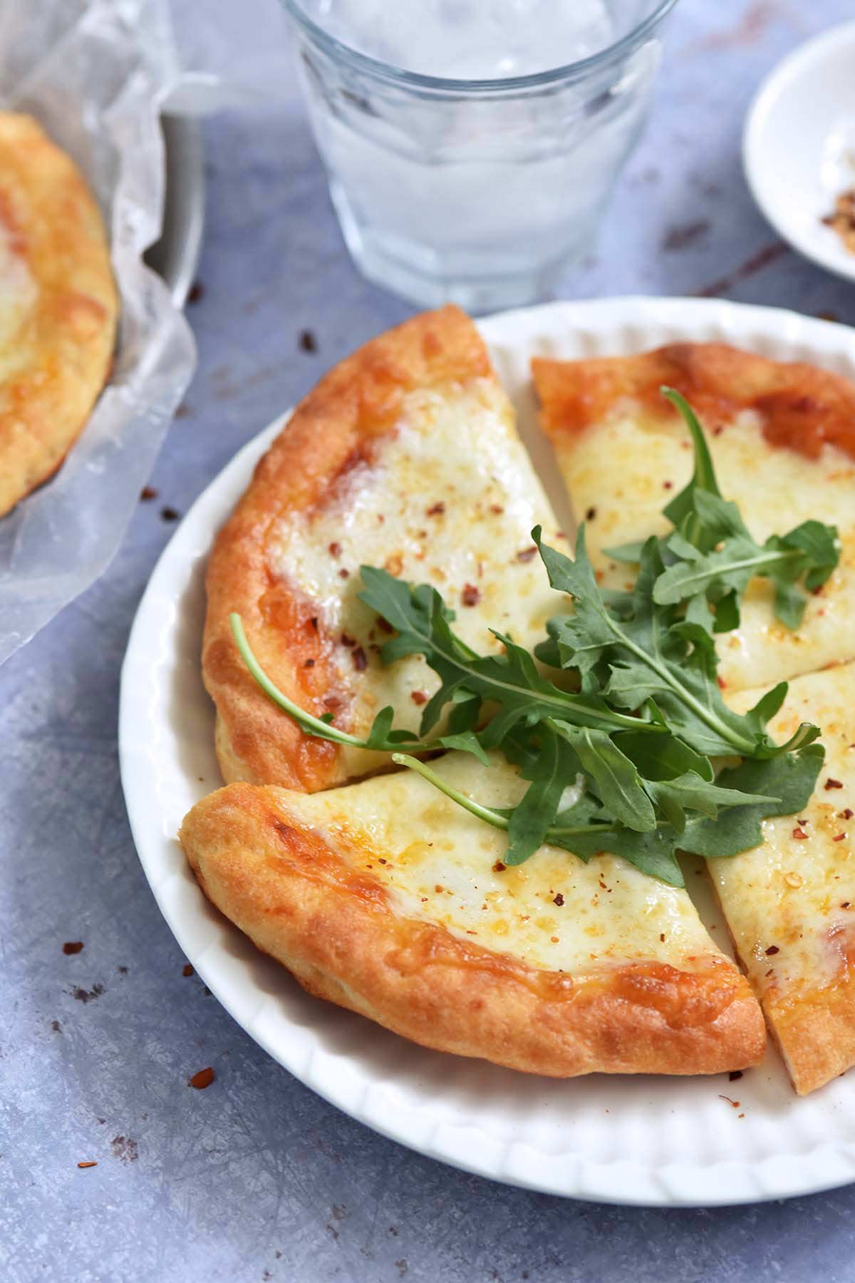homemade personal pan pizza made with healthy high protein greek yogurt dough