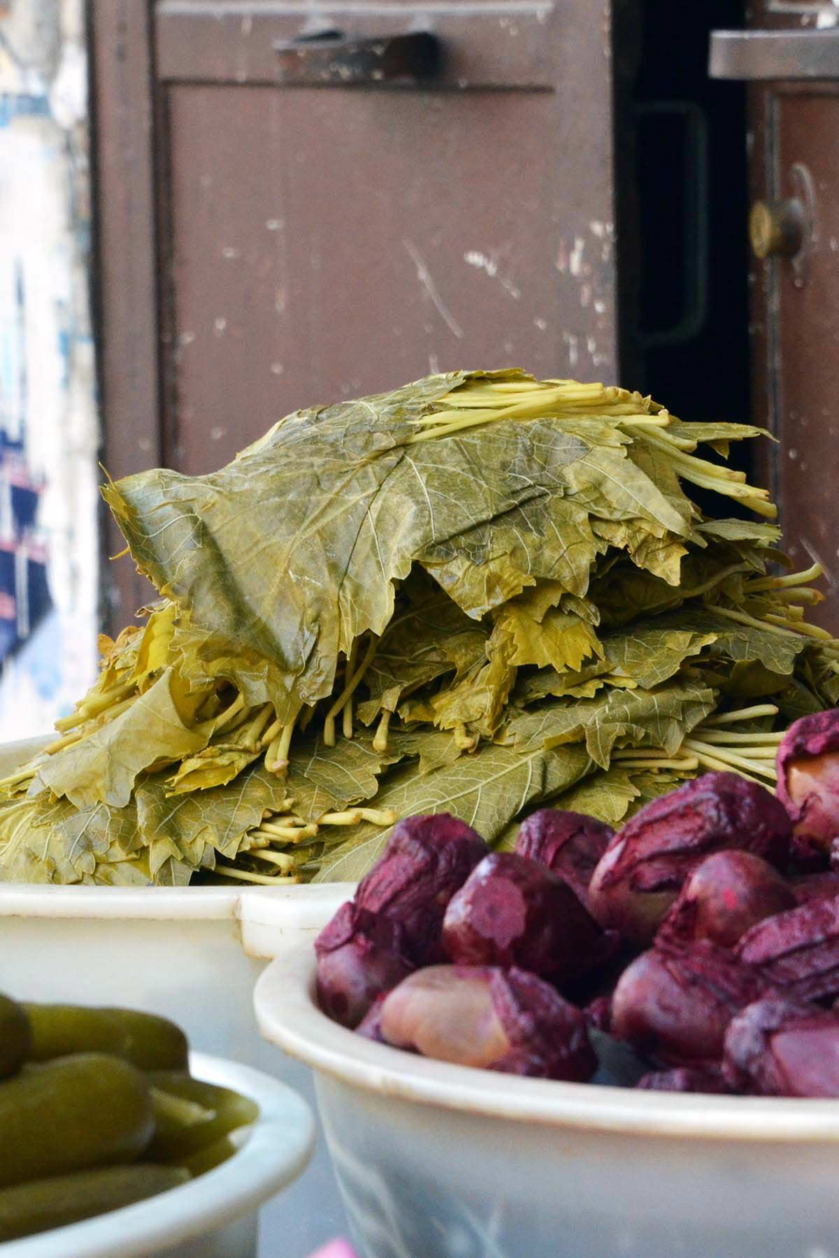 stack of grape leaves at old market in Damascus Syria