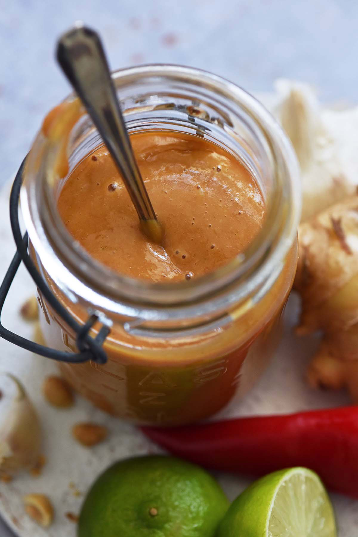 close up of peanut sauce for noodles in glass jar