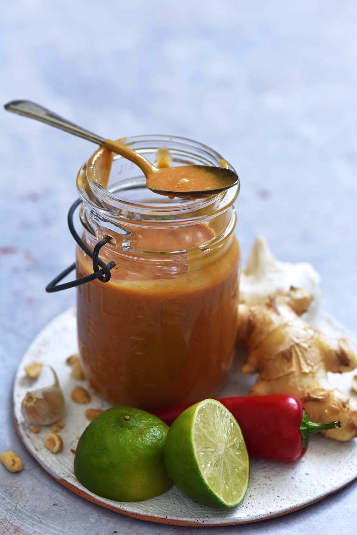 simple peanut sauce recipe in glass jar with Thai aromatics