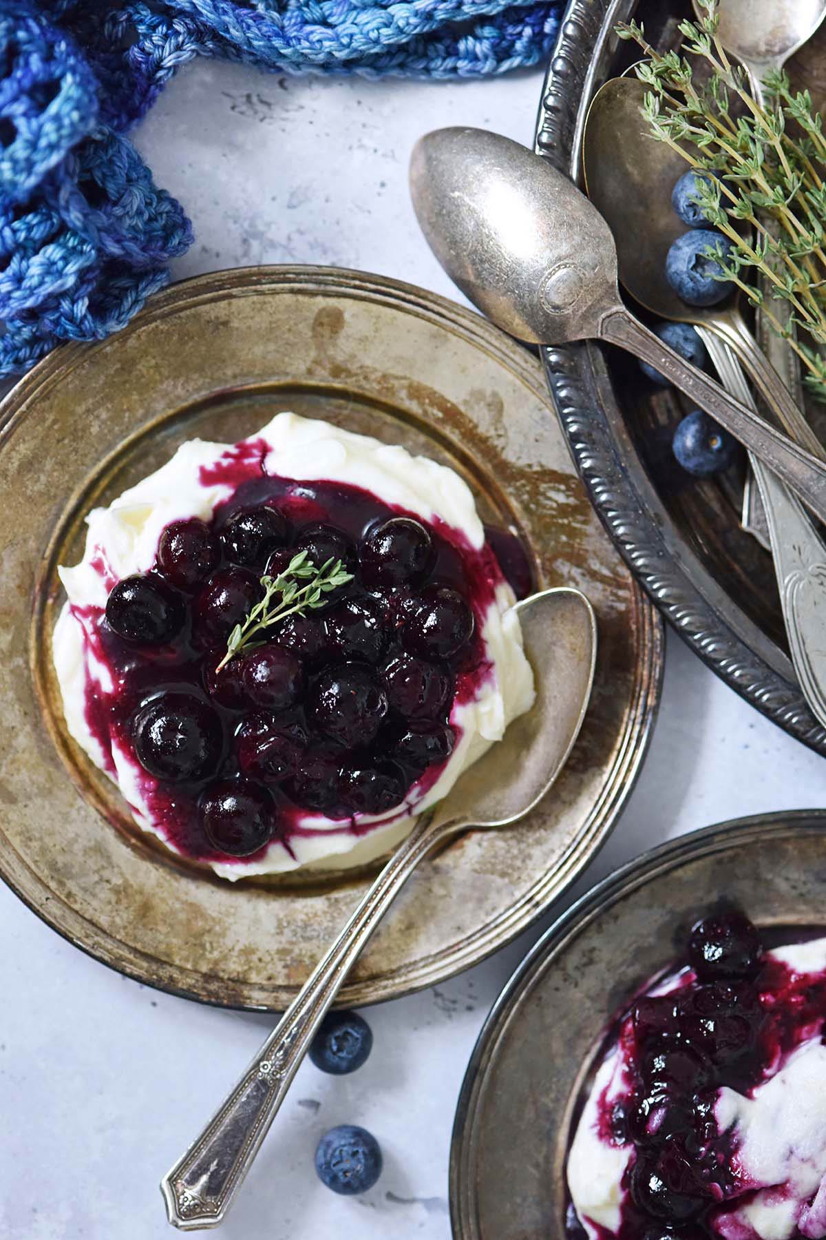 baked blueberries on mascarpone cheesecake mousse with crochet shawl inspired by Arwen from the lord of the rings