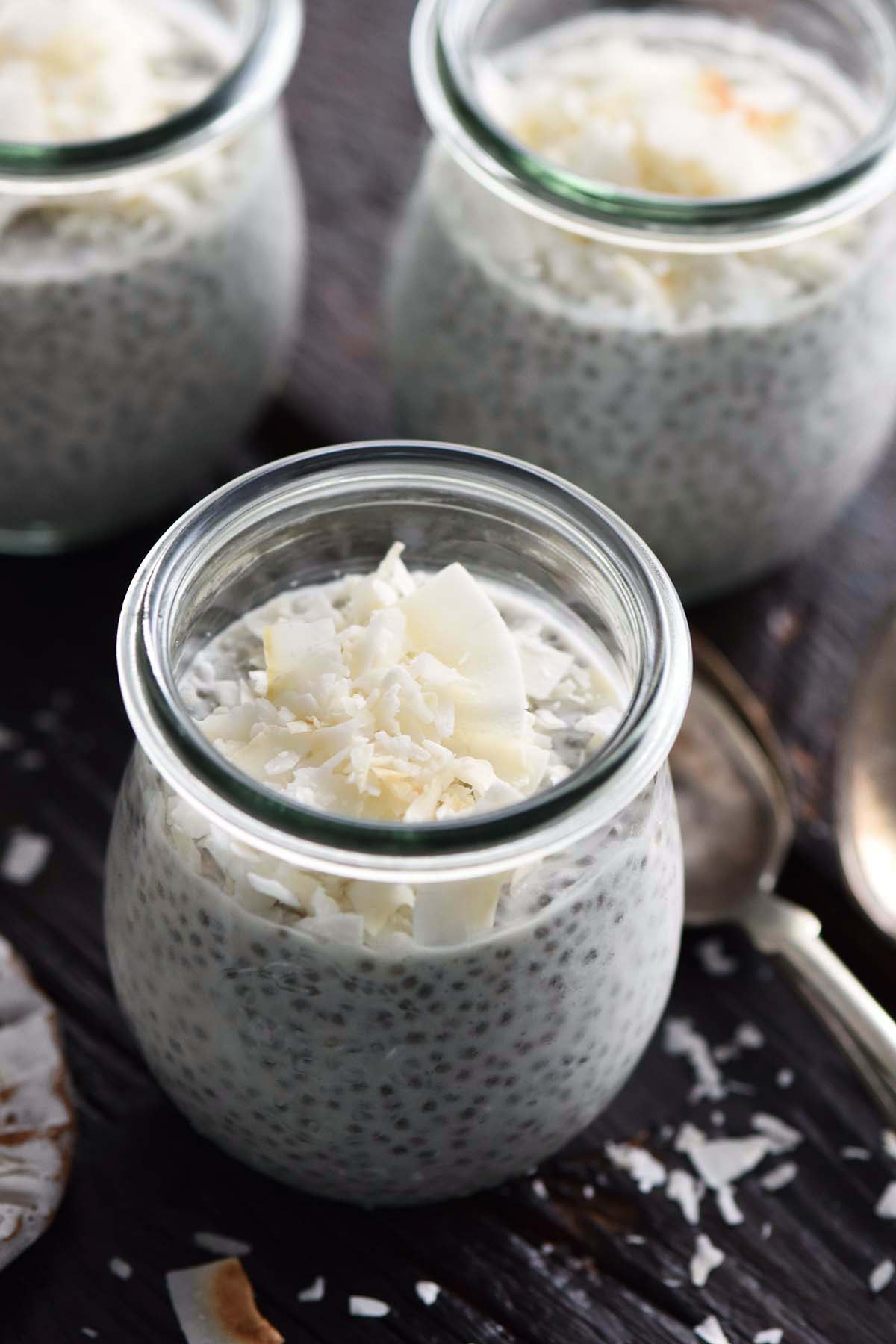 close up of meal prepped chia pudding with coconut for breakfast snacks or healthy desserts