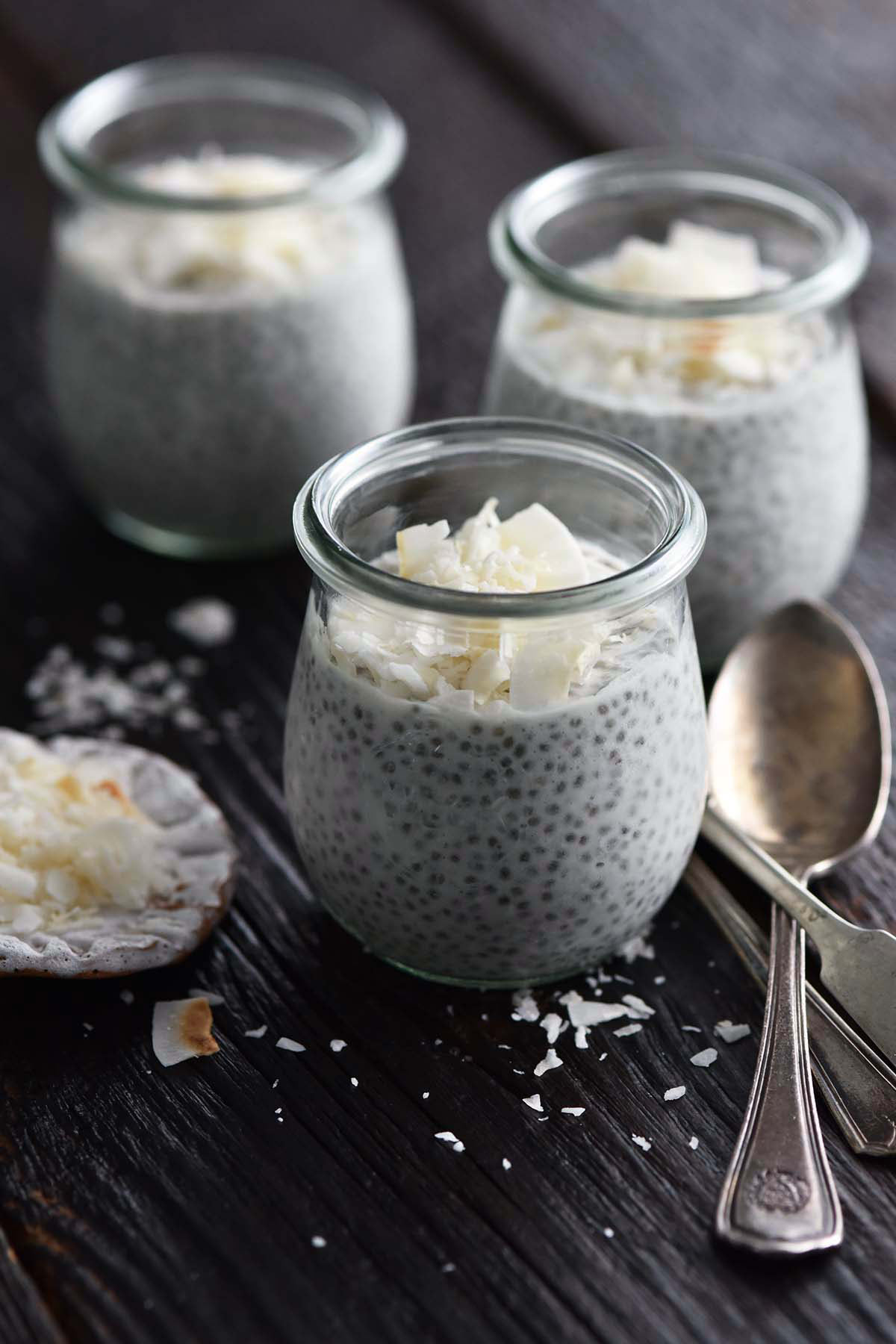 coconut milk chia seed pudding with coconut flakes in weck jars