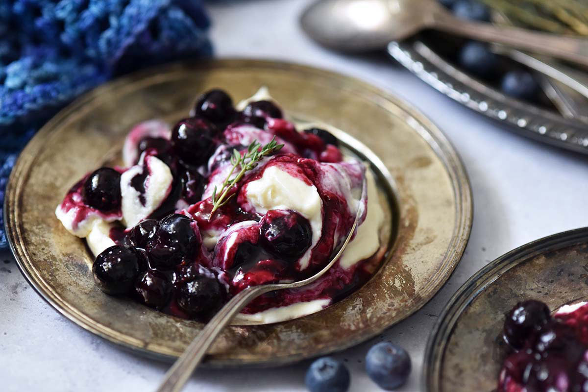 front view of easy mascarpone cheesecake mousse with blueberry sauce