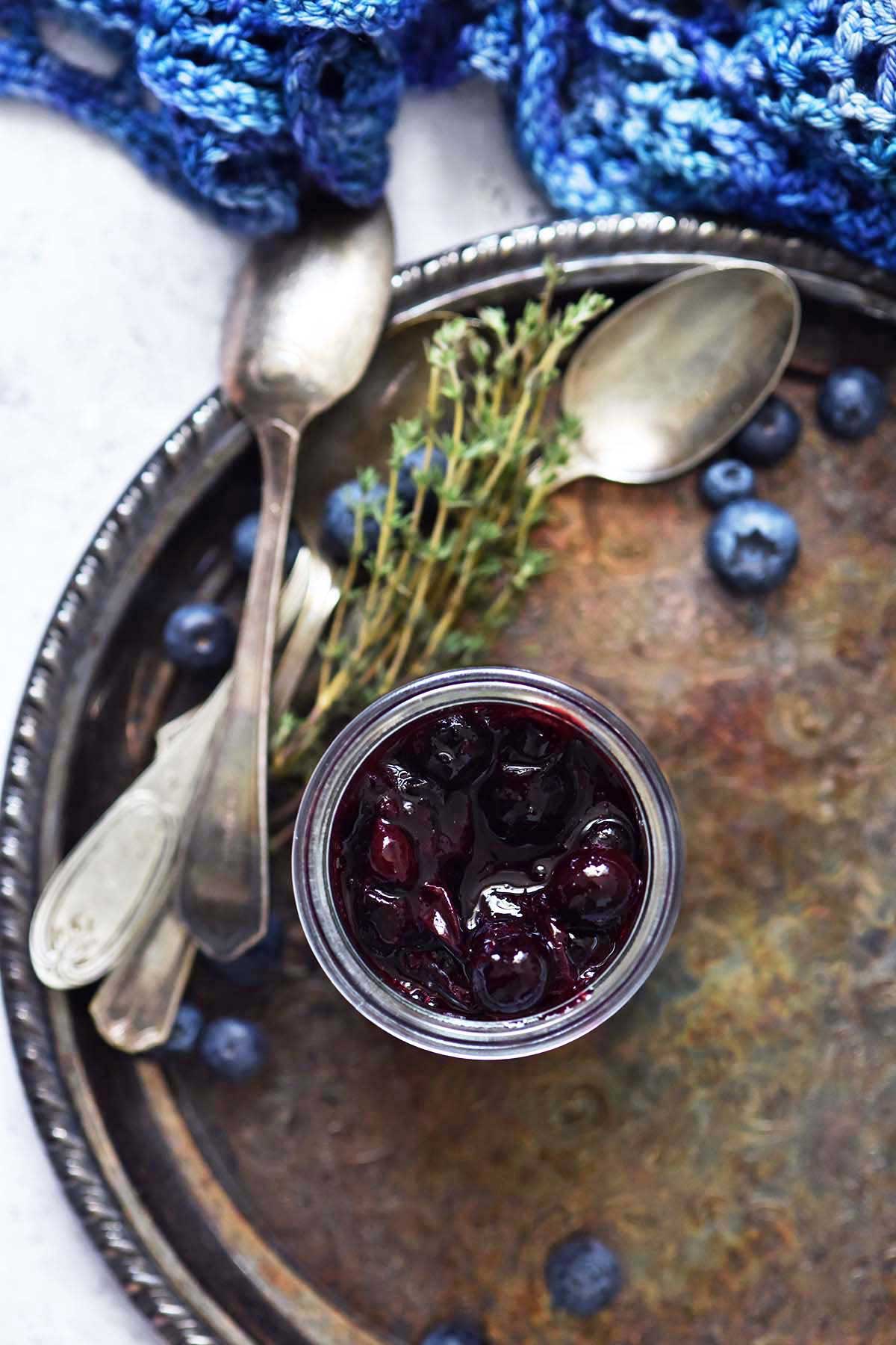 roasted blueberry sauce in glass weck jar on metal tray
