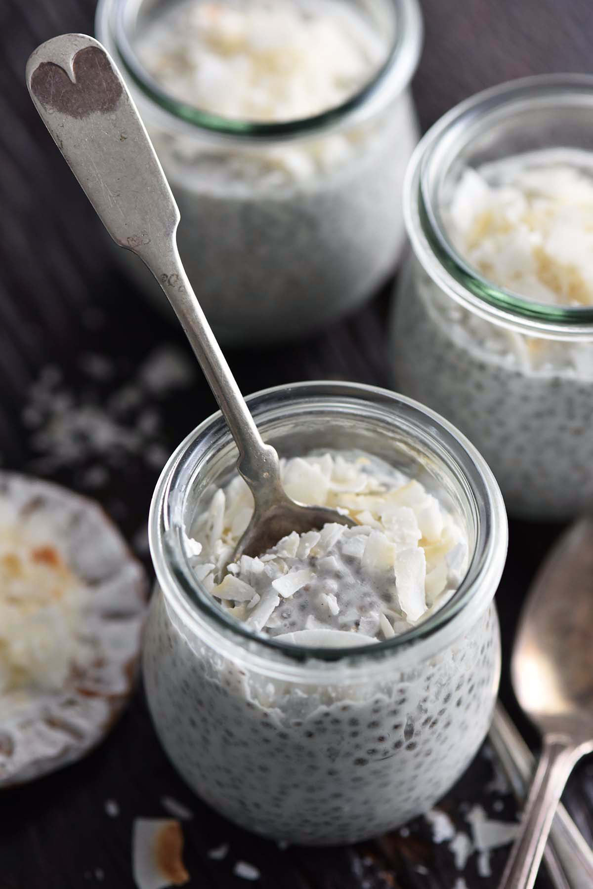 vintage spoon in small glass weck jar with coconut milk chia pudding