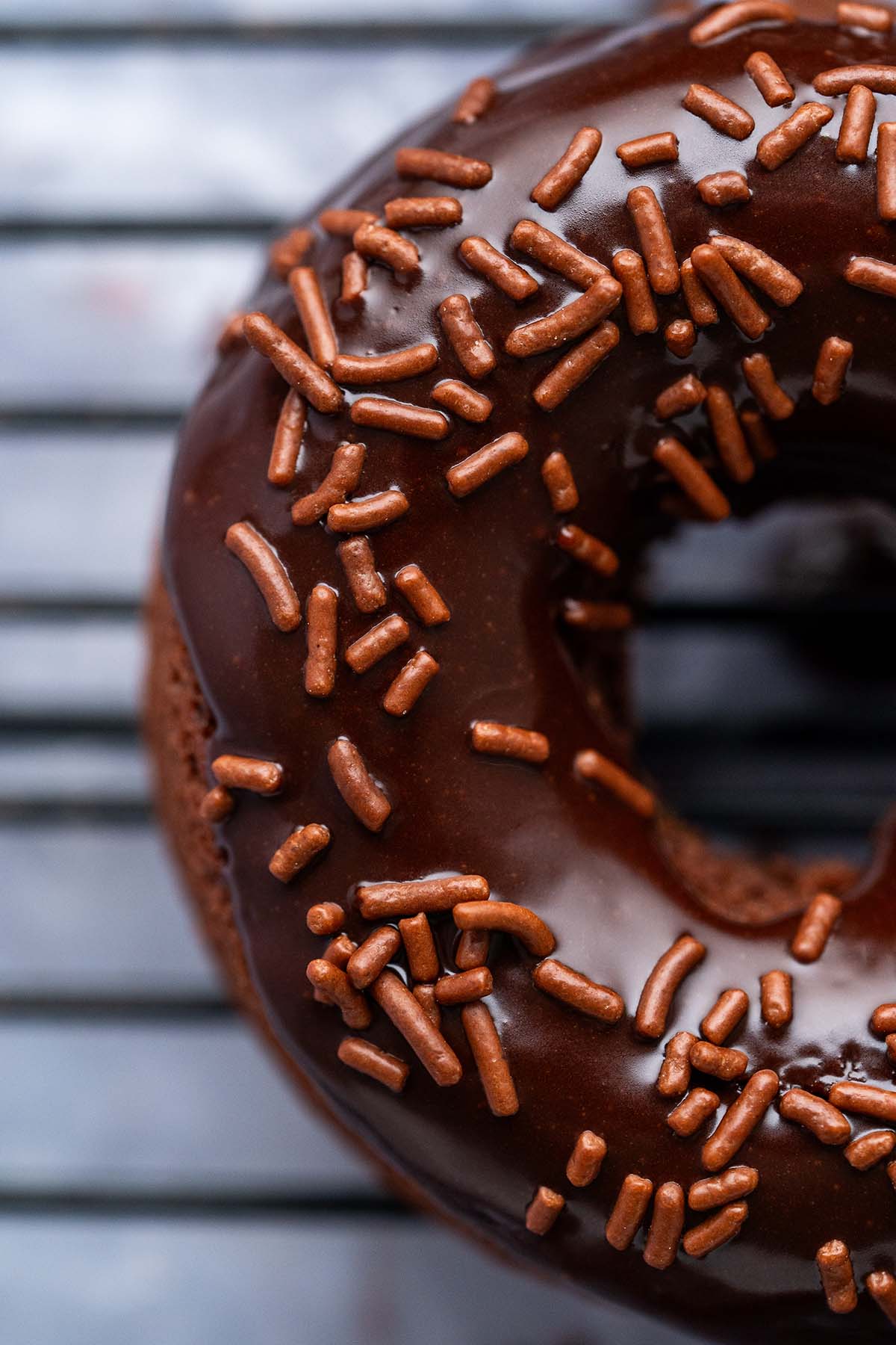 close up of chocolate glaze on cake donut