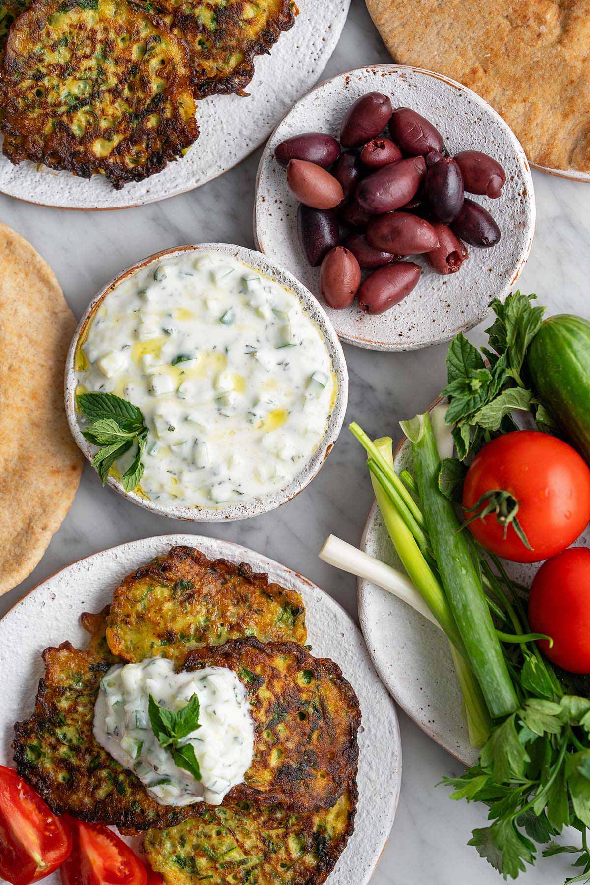 middle eastern mezze spread with ejjeh vegetables olives flatbread