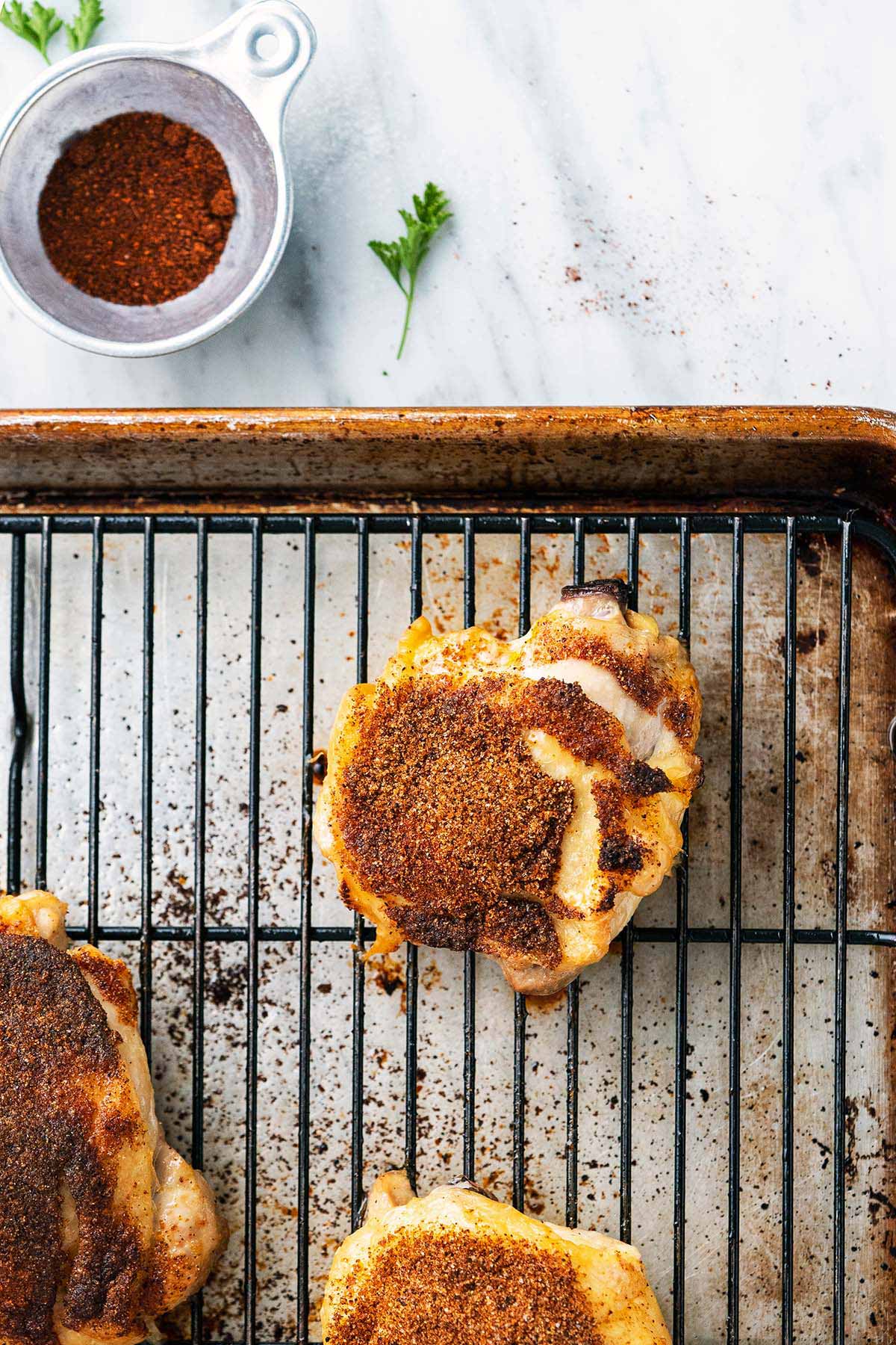 roasted dry rub bbq chicken thighs on baking tray