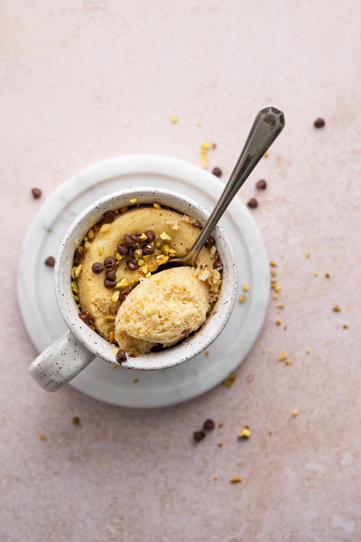 top view of healthy microwave cake in stoneware mug