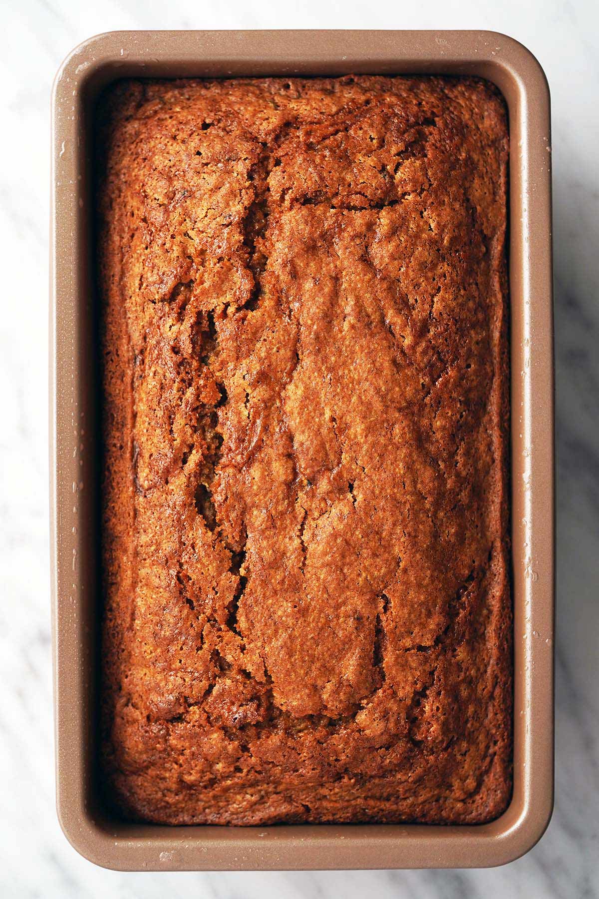 top view of sourdough discard zucchini bread in 9 by 5 inch loaf pan