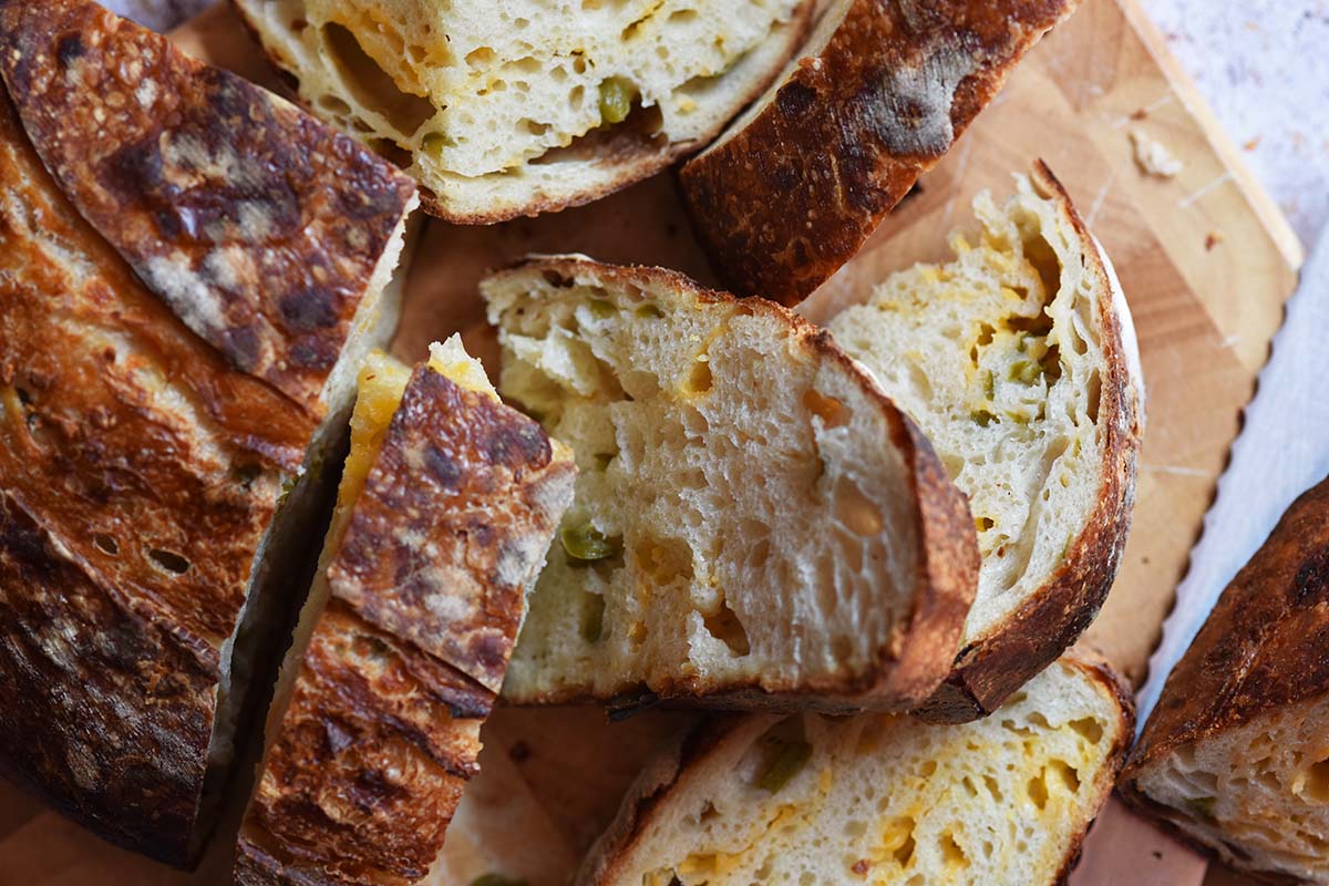 chewy artisan sourdough loaf with cheddar cheese and jalapenos