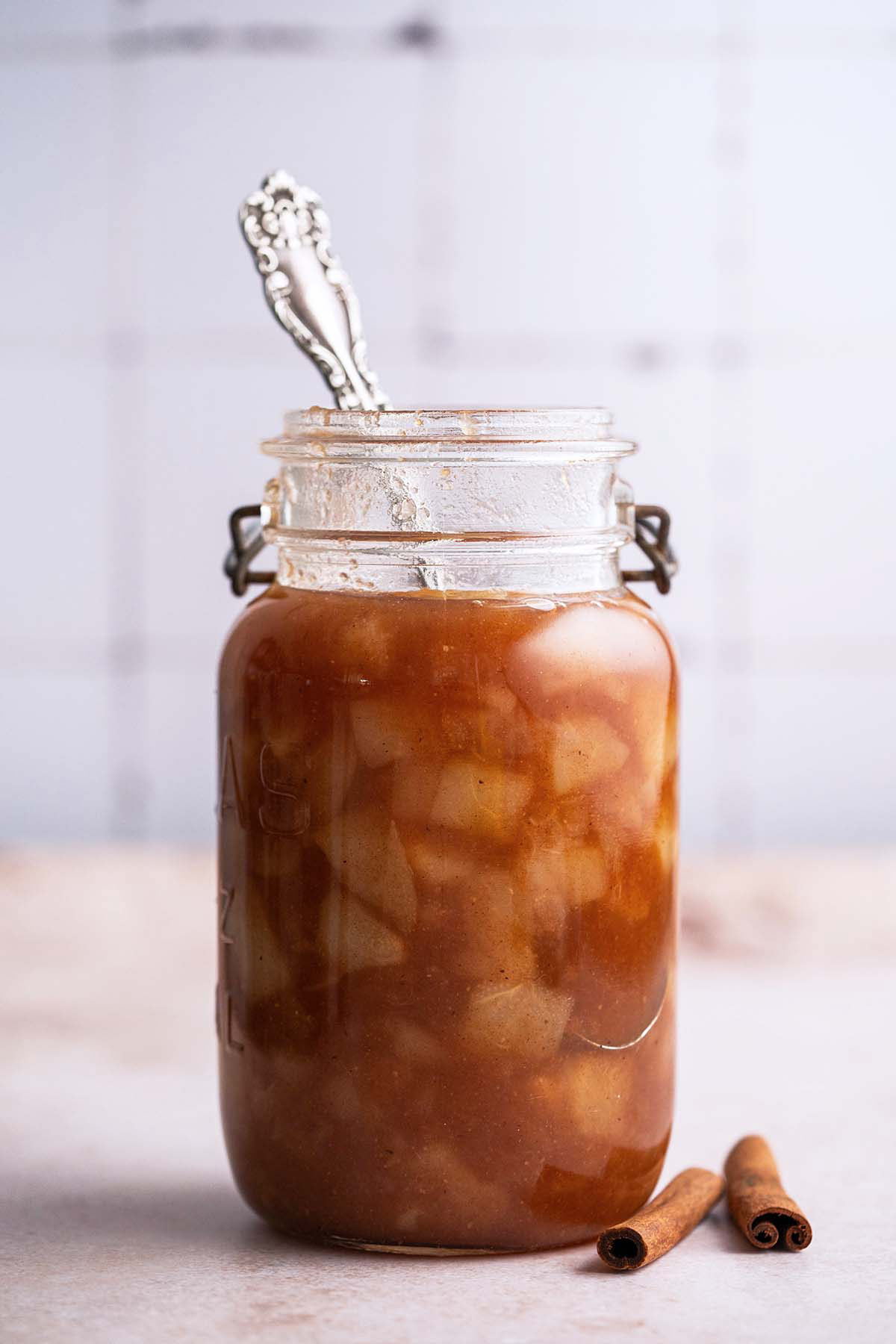 front view of glass jar with homemade pear preserves