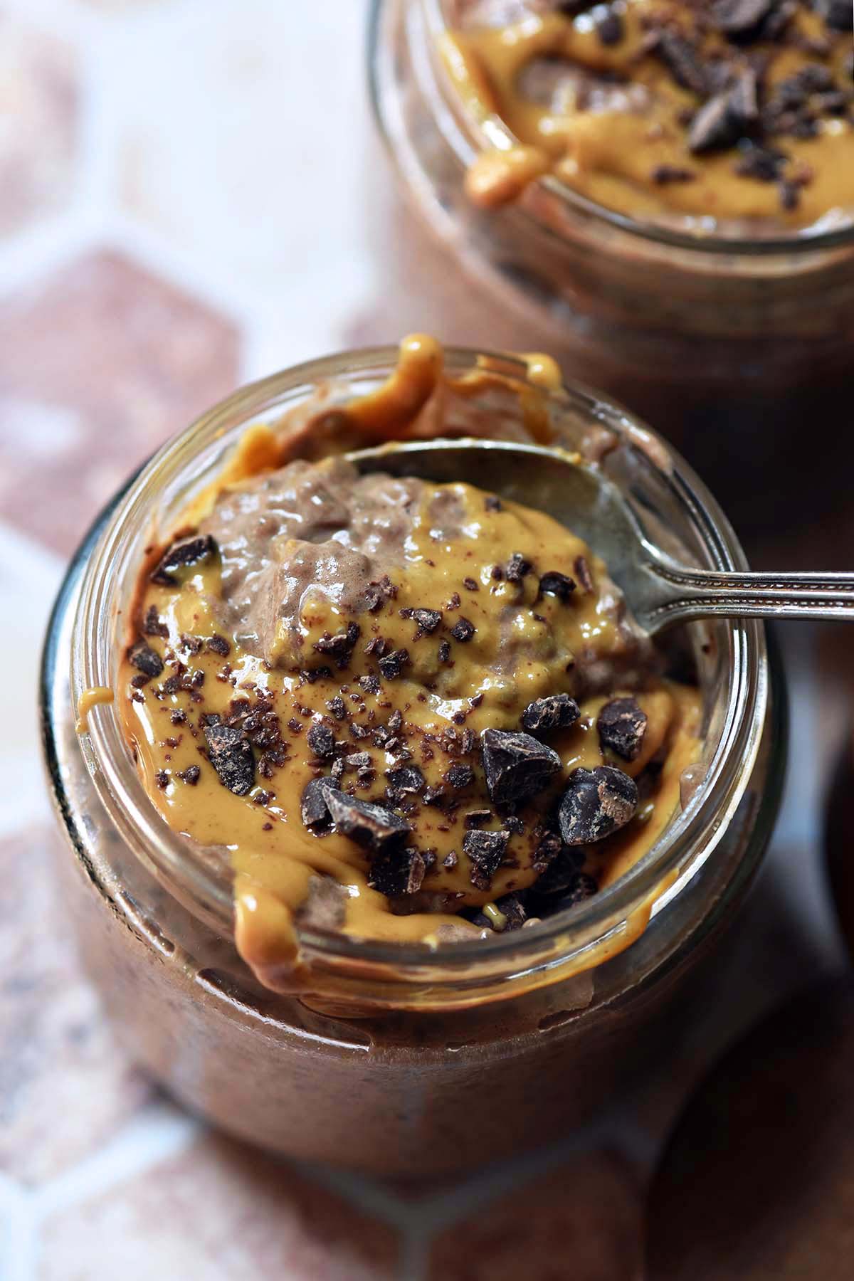 high protein chocolate chia pudding in meal prep glass jars