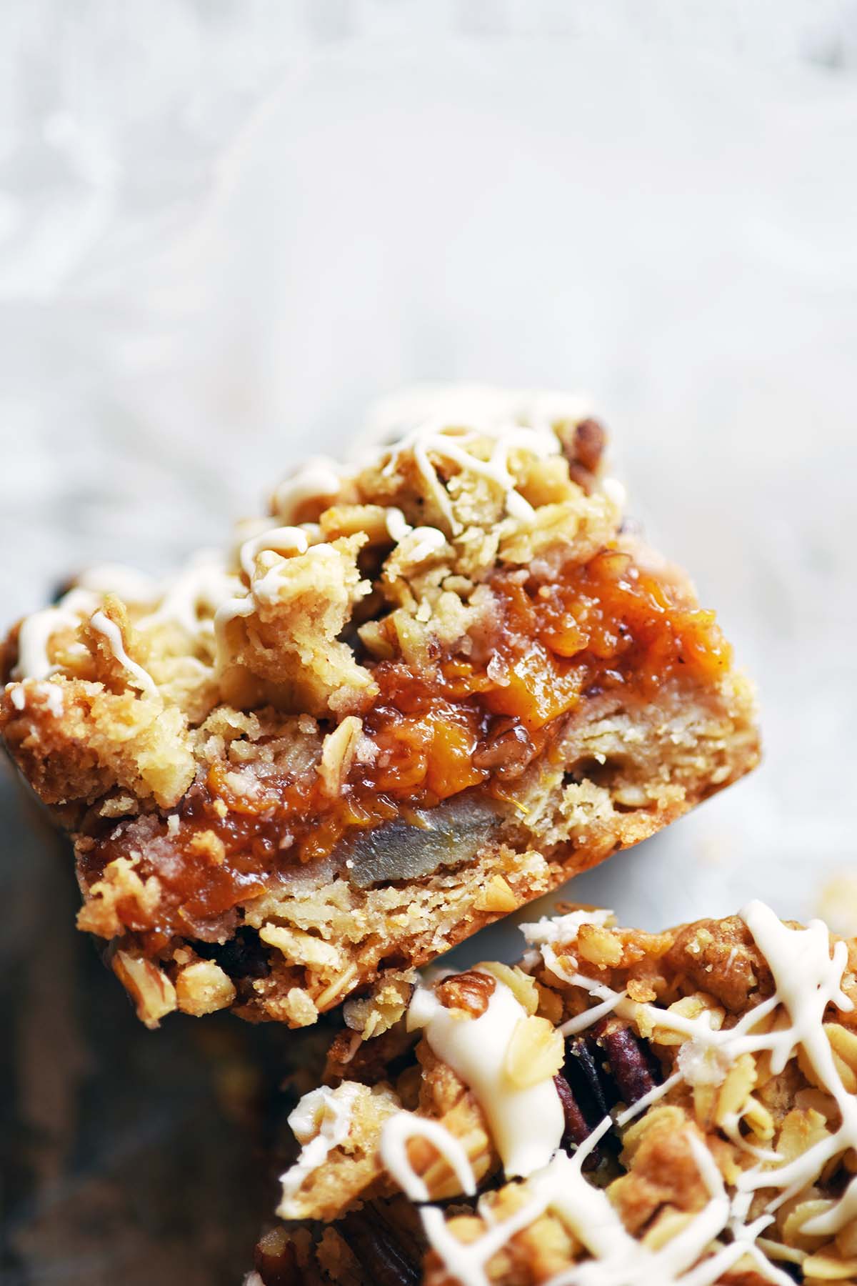 peach bar on its side to show jammy filling and streusel topping
