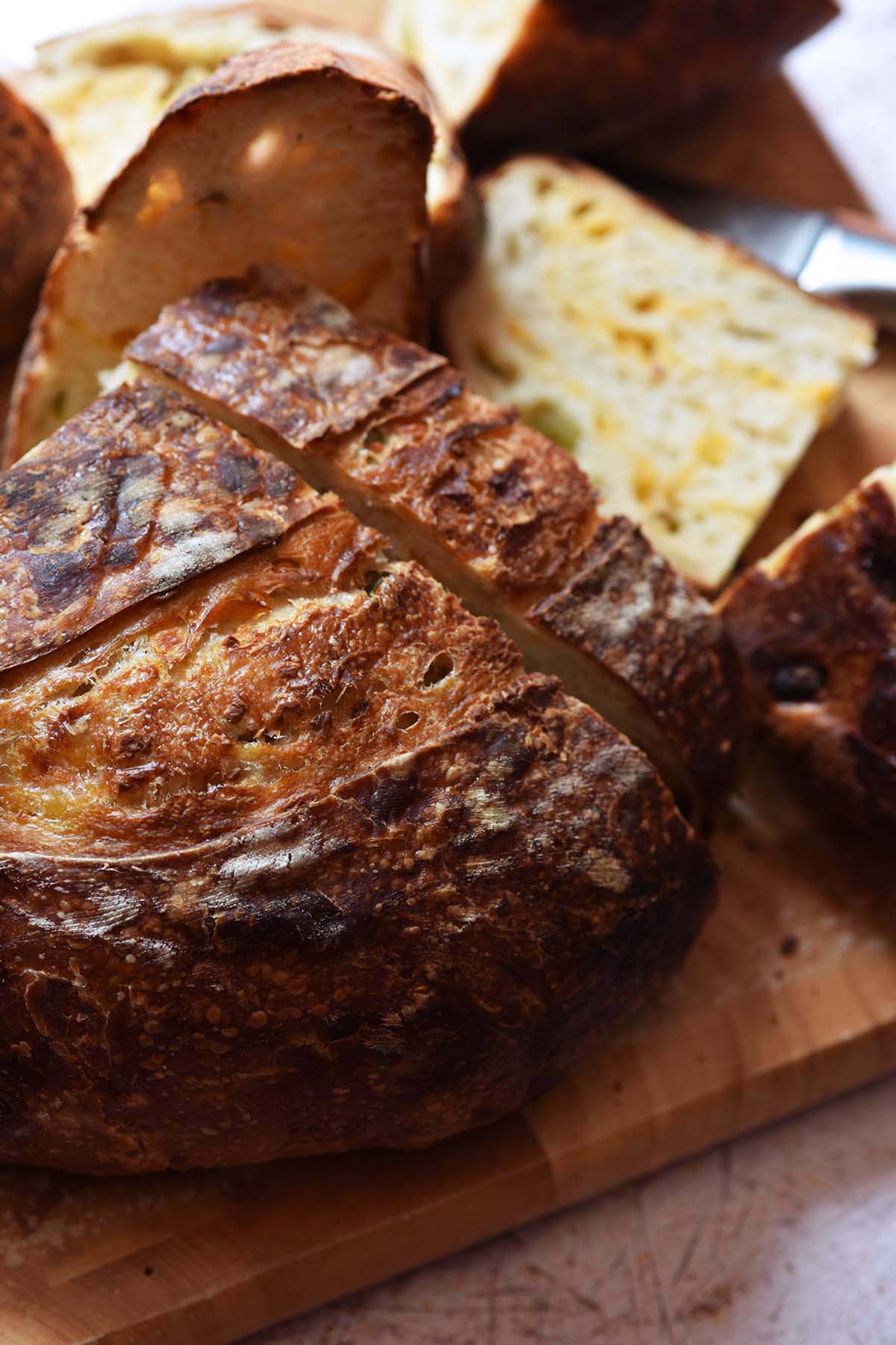slicing a crusty sourdough loaf