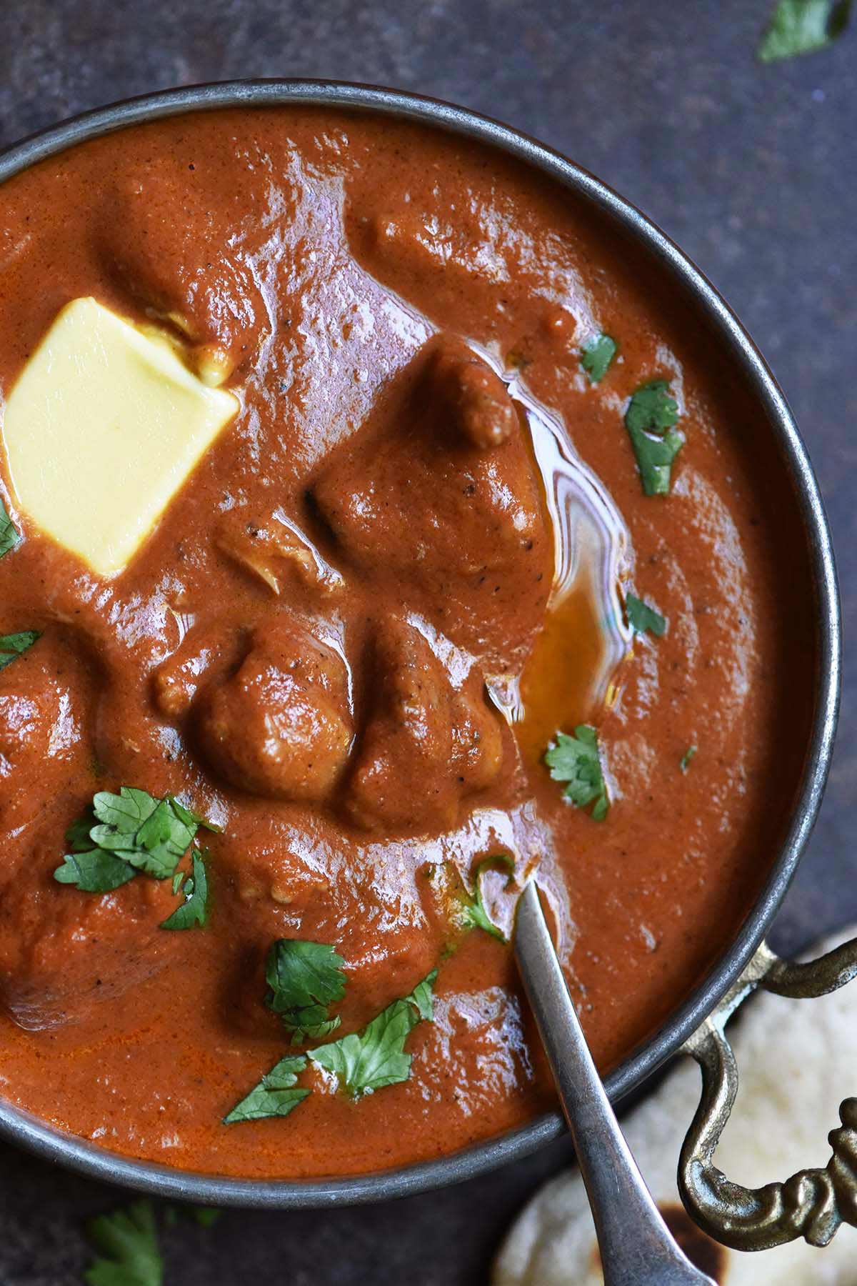 close up top view of rich and creamy butter chicken sauce