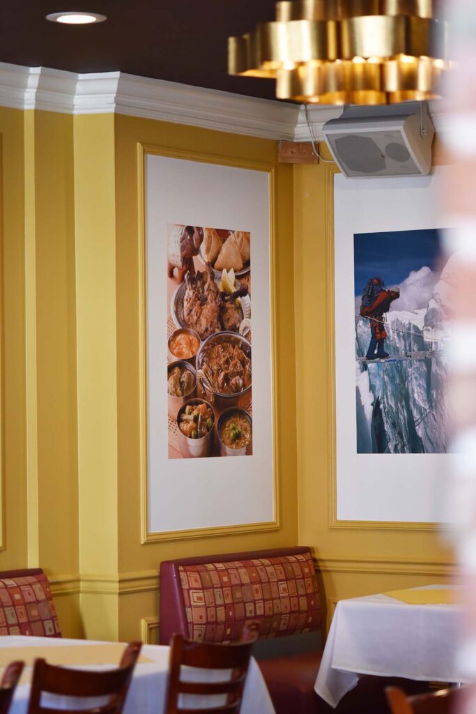 artwork and tables in banquet hall at DIYA