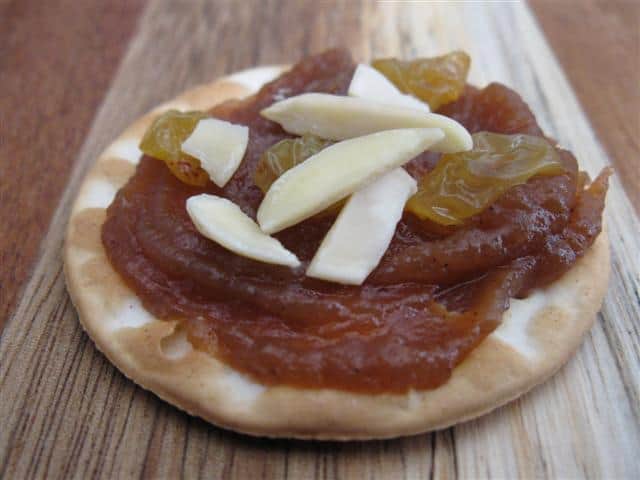 Water Crackers Topped with Apple Butter, Slivered Almonds, and Golden Raisins