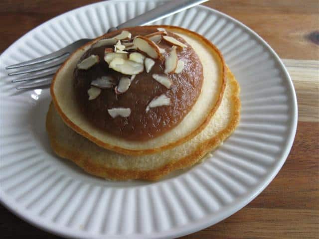 Pancakes Topped with Warm Apple Butter and Sliced Almonds (Mix 1 part apple butter with 1 part water)