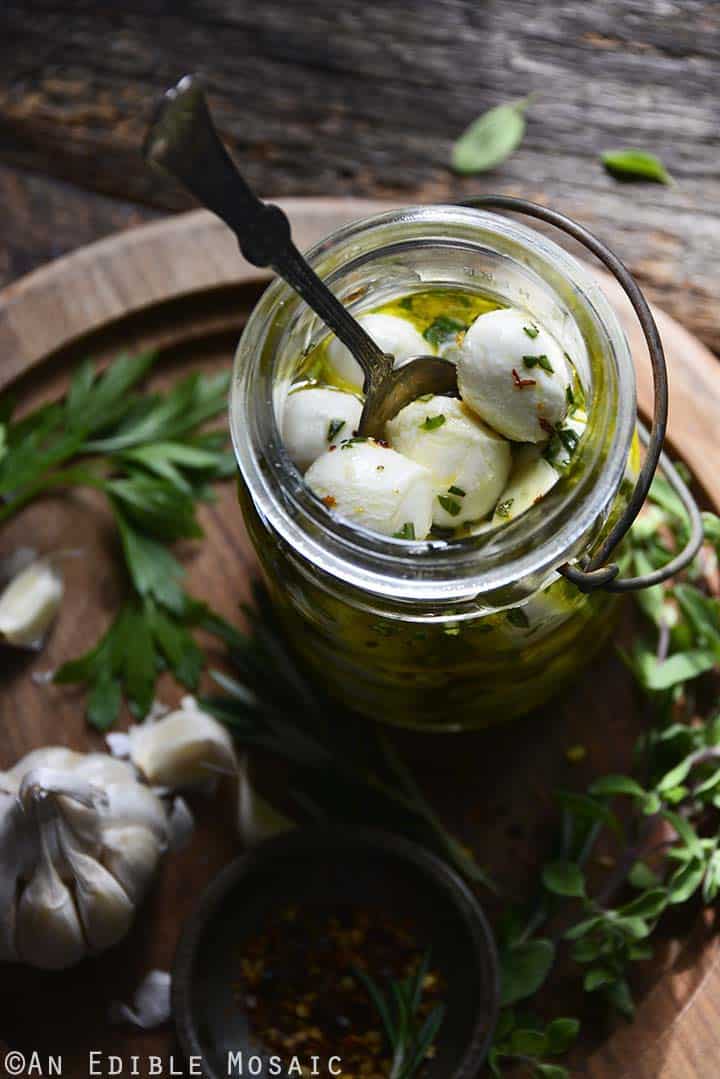 mozzarella balls marinating in mason jar