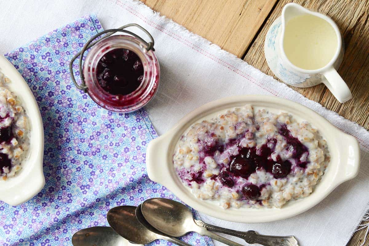 Creamy Vegan Wheat Berry Porridge with Gingered Blueberry Sauce An