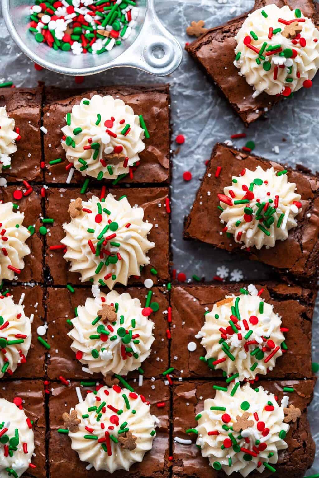 overhead view of chrisstmas brownies recipe with eggnog frosting on top of crinkled wax paper